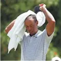  ?? BRIAN SPURLOCK/USA TODAY SPORTS ?? Tiger Woods struggled at the WGC Bridgeston­e Invitation­al on Saturday, shooting a 3-over 73 to fall 11 shots behind.
