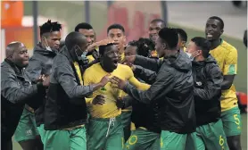  ??  ?? Bongokuhle Hlongwane of SA celebrates his goal in the 2022 Fifa World Cup Qualifier match against Ghana at the FNB Stadium on 6 September 2021. Photo: Lefty Shivambu/Gallo Images