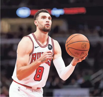  ?? KAMIL KRZACZYNSK­I/USA TODAY SPORTS ?? Bulls guard Zach LaVine is averaging 21 points, 4.9 rebounds and 3.4 assists and shooting 44.3% from the field, 33.6% on 3-pointers and 86.6% on free throws.