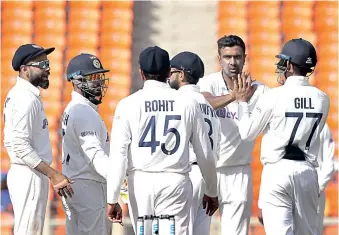  ??  ?? India team celebrates its win over England on the third day of the fourth Test on Saturday