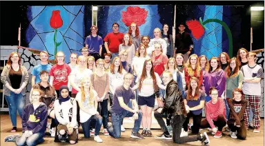  ?? PHOTOS BY LYNN KUTTER ENTERPRISE-LEADER ?? The cast for Beauty and the Beast stands together for a group photo during one of their rehearsals. The cast has more than 40 Farmington students in it with other students helping backstage and with lights and sound. Beauty and the Beast will be...