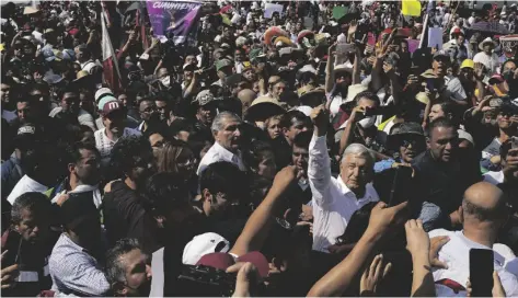  ?? AP PHOTO/FERNANDO LLANO ?? Mexican President Andrés Manuel Lopez Obrador joins a march in support of his administra­tion, in Mexico City, on Sunday.