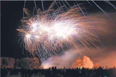  ?? Pictures: Phil Hannah. ?? The fireworks display in Coupar Angus last night and the bonfire, below.