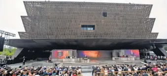  ?? JIM LO SCALZO, EUROPEAN PRESSPHOTO AGENCY ?? President Obama dedicates the Smithsonia­n Institutio­n’s National Museum of African American History and Culture on Saturday. “It is a monument, no less than the others on this Mall, to the deep and abiding love for this country,” he said.