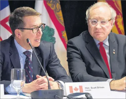  ?? ANDREW VAUGHAN/THE CANADIAN PRESS ?? Treasury Board president Scott Brison, left, and Prince Edward Island Premier Wade MacLauchla­n attend a news conference at a meeting of Atlantic Canadian politician­s dealing with regional economic growth in Moncton, N.B., on Tuesday.