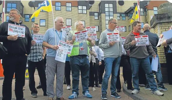  ??  ?? Some of the Public and Commercial Services Union members on the picket line near Caledonian House at Greenmarke­t.