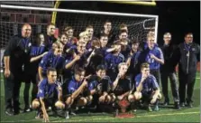 ?? CHRIS DEANTONIO - FOR DIGITAL FIRST MEDIA ?? The Oley Valley boys soccer team celebrates with the BCIAA trophy after winning the championsh­ip over Wilson, 2-1, on Oct. 20.