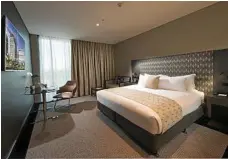  ?? PHOTO: ROSS EASON ?? Kick back in a king room at Ibis and Pullman Hotels Brisbane Airport.