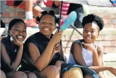  ?? Picture: EUGENE COETZEE ?? SPECTATOR SPORT: Supporters, from left, Sinovuyo Rebe, Timna Mki and Lonwabo Nyingwa watched the boys play rugby at the Westering Sports Festival last Saturday