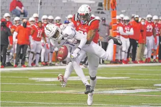  ?? RICK SCUTERI/ASSOCIATED PRESS ?? Ball State cornerback Antonio Phillips, rear, knocks away a pass intended for San Jose State wide receiver Jermaine Braddoc on Thursday in the Arizona Bowl in Tucson, Ariz.