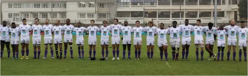  ?? Photo: Stephen Penney ?? The Rhodes University first rugby side lines up before the start of a Varsity Shield match.