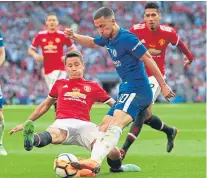  ?? Getty. ?? Ander Herrera challenges Eden Hazard.