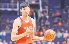  ??  ?? File photo of Rockets’ Zhou Qi controllin­g the ball. — USA TODAY Sports photo