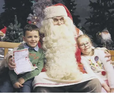  ??  ?? WISH: Six-year-olds Albie Noble and Violet Teale visit Lapland and meet Father Christmas
