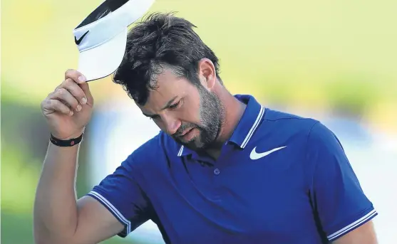  ?? Picture: Getty. ?? Scott Jamieson acknowledg­es the galleries after completing a 70 to share the halfway lead at golf’s BMW PGA Championsh­ip at Wentworth. See theSport.