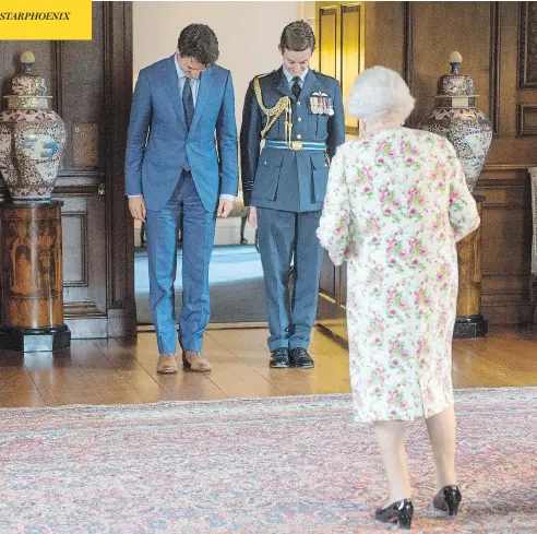  ?? RYAN REMIORZ /THE CANADIAN PRESS ?? Prime Minister Justin Trudeau bows as he meets Queen Elizabeth at Holyrood Palace, her official residence in Edinburgh, on Wednesday.