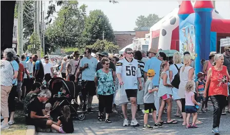  ?? ALLAN BENNER THE ST. CATHARINES STANDARD ?? Hundreds of people gathered Monday to celebrate the heritage of the Facer Street district, during the third annual Facer European Festival.