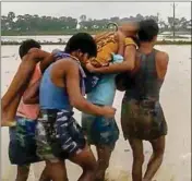  ??  ?? Villagers carry a man to a hospital after getting injured in a lightning strike, in Katihar district of Bihar, on Thursday