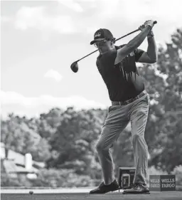  ?? JACOB KUPFERMAN/AP ?? Phil Mickelson tees off on the seventh hole during the first round of the Wells Fargo Championsh­ip golf tournament at Quail Hollow on Thursday in Charlotte, N.C.