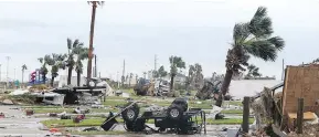  ?? GABE HERNANDEZ / CORPUS CHRISTI CALLER-TIMES VIA AP ?? Scenes of devastatio­n after Hurricane Harvey landed Saturday in Texas. Harvey came ashore Friday as a Category 4 storm with 130 mph (210 km/h) winds.