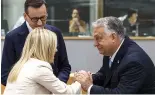  ?? ?? Hungary's Prime Minister Viktor Orban, right, speaks with Italy's Prime Minister Giorgia Meloni, centre, and Poland's former Prime Minister Mateusz Morawiecki, le