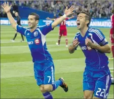  ?? CHRISTINNE MUSCHI REUTERS ?? Impact captain Davy Arnaud (right) celebrates his goal with Felipe Martins during club’s MLS home opener Saturday against the Chicago Fire.