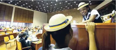  ?? RICARDO MAKYN/MULTIMEDIA PHOTO EDITOR ?? Sandrene McKenzie (right) of Westwood High School, Trelawny, speaks with a school mate at the Ananda Alert Missing Children's Forum at the Jamaica Conference Centre in Kingston, yesterday.