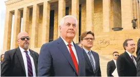  ?? ADEM ALTAN/AGENCE FRANCE-PRESSE VIA GETTY IMAGES ?? Secretary of State Rex Tillerson, center, leaves after a wreath laying ceremony at Anitkabir, the mausoleum of Turkey's modern founder Mustafa Kemal Ataturk, in Ankara on Thursday.