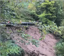  ??  ?? The landslide which has shut the main road at Eas Mor.