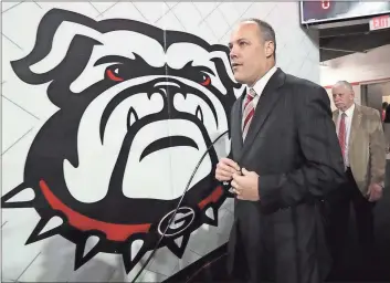  ?? Curtis Compton / AJC via AP ?? Georgia head coach Mark Fox takes the court for the final home game of the season against Texas A&M.