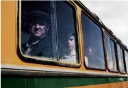  ??  ?? From top Local extras, playing miners, await filming in one of a fleet of 1980s buses; the recreated mobile command centre
