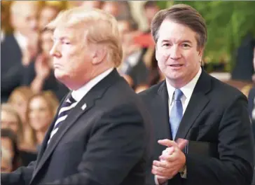  ?? BRENDAN SMIALOWSKI/AFP ?? Donald Trump defended Supreme Court Justice Brett Kavanaugh (right) after a former Yale classmate of Kavanaugh alleged that the jurist exposed himself at a freshman year party.