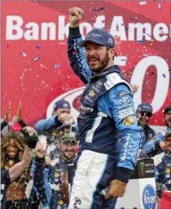  ?? CHUCK BURTON — THE ASSOCIATED PRESS ?? Martin Truex Jr celebrates in Victory Lane after winning a NASCAR Cup Series auto at Charlotte Motor Speedway in Concord, N.C., Sunday. race