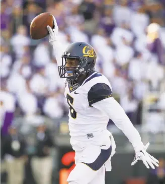  ?? Elaine Thompson / Associated Press ?? Cal cornerback Darius White celebrates after recovering a Washington fumble in the fourth quarter to kill a Huskies drive. The Bears forced five turnovers and amassed five sacks.