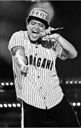  ?? BUCKNER/REX SHUTTERSTO­CK ?? Bruno Mars, shown performing during the BET Awards in June, was nominated for artist of the year.