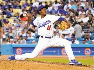  ?? MARK J. TERRILL Associated Press ?? THE DODGERS’ Josiah Gray throws his first major league pitch during the third inning against the Giants. Gray pitched four innings and gave up four runs. He surrendere­d three home runs.
