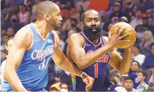  ?? RONALD MARTINEZ / GETTY ?? The 76ers’ James Harden drives as the Clippers’ Nicolas Batum defends during the first quarter Friday night at Crypto.com Arena. Harden had 29 points and a season-high 15 rebounds as the 76ers rolled to a 122-97 victory.