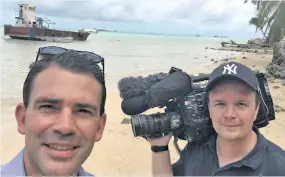  ??  ?? From left: Michael Morrah and John Flemming before they were taken in for questionin­g by Kiribati immigratio­n.