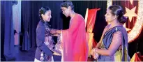  ??  ?? Best sports woman of the year Sandali Kanishka Udagedara receives colours from the chief guest Sriyani Kulawansa.
