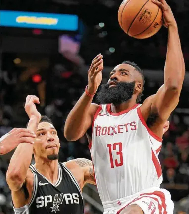  ?? Darren Abate / Associated Press ?? James Harden served as the Rockets’ safety net all game long Thursday night against Danny Green and the Spurs. With 28 points and 11 assists, Harden ensured the Rockets retained the upper hand throughout the game.