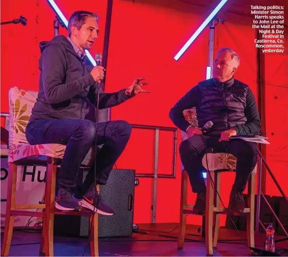  ?? ?? Talking politics: Minister Simon Harris speaks to John Lee of the Mail at the Night & Day Festival in Castlerea, Co. Roscommon, yesterday