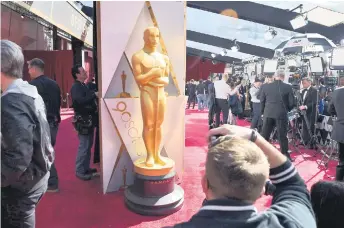 ?? — AFP photo ?? Photograph­ers and TV crews get ready on the red carpet a few hours before the ‘Oscars’, the 90th Annual Academy Awards in Hollywood, California.