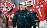  ?? AP-John Bazemore, File ?? Bulldog’s coach Kirby Smart, center, expects changes coming to Georgia’s offense with a new quarterbac­k, who is expected to be Wake Forest transfer Jamie Newman.