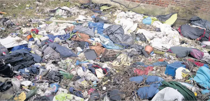  ??  ?? ●●The area near St Mary’s Church in Stockport is full of rubbish Pictures: Vincent Cole