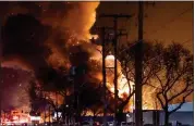  ?? GREG GRENIER — FOR MEDIANEWS GROUP ?? Debris rained down in a large radius as flames lit up the sky Monday night.