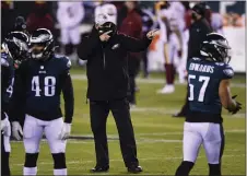  ?? DERIK HAMILTON - THE ASSOCIATED PRESS ?? He may have been pointing definitive­ly before Sunday’s season finale against Washington, but Doug Pederson’s quarterbac­k maneuverin­gs sent mixed signals to his Eagles, some of which weren’t well-received in the locker room.