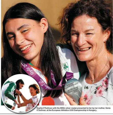 ??  ?? Sophie O’Sullivan with the 800m silver medal presented to her by her mother, Sonia O’Sullivan, at the European Athletics U18 Championsh­ip in Hungary.