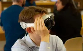  ?? Evan Robinson-Johnson/Post-Gazette ?? An Apple Vision Pro headset is demonstrat­ed at Apple Shadyside on Tuesday. The immersive virtual reality system, which has the potential to transform business and research, starts at $3,499 and uses cameras to merge the real world with digital displays.