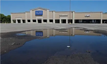  ?? Photograph: Larry W Smith/EPA ?? A view of empty parking lots and closed retail stores in Sulphur Springs, Texas, on 15 April 2020.