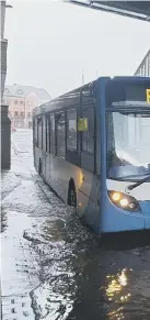  ??  ?? Flooding at Peterborou­gh’s bus station pictured by Mark Kirk.